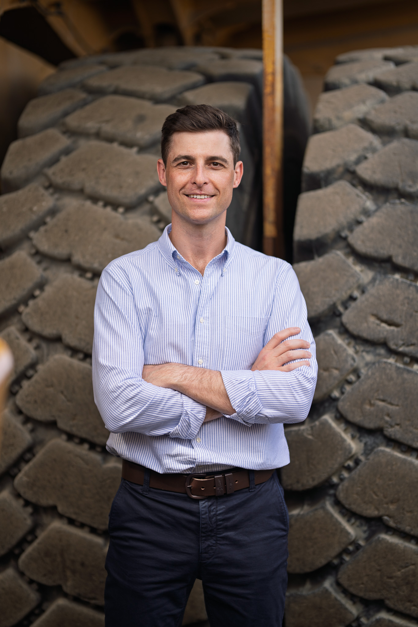 James Allan in front of heavy equipment