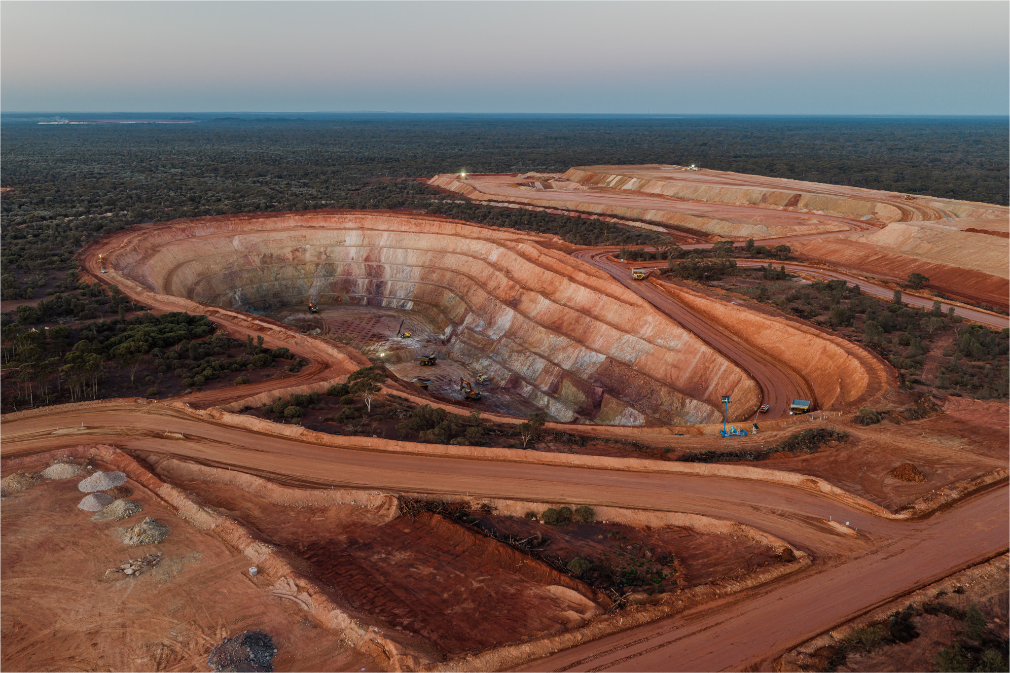 Aerial view of an open pit mine and haul roads