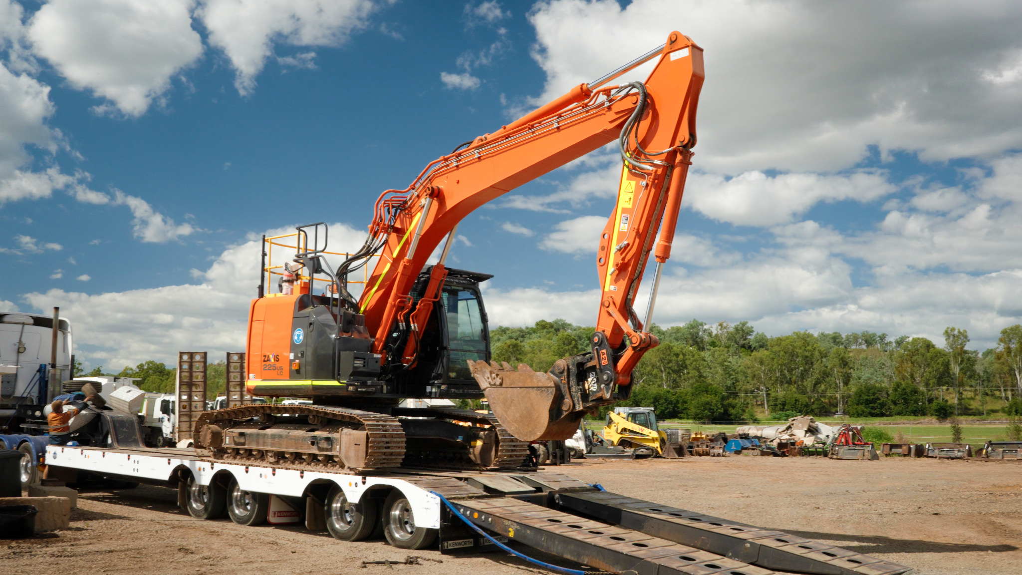 KBH excavator on a low loader