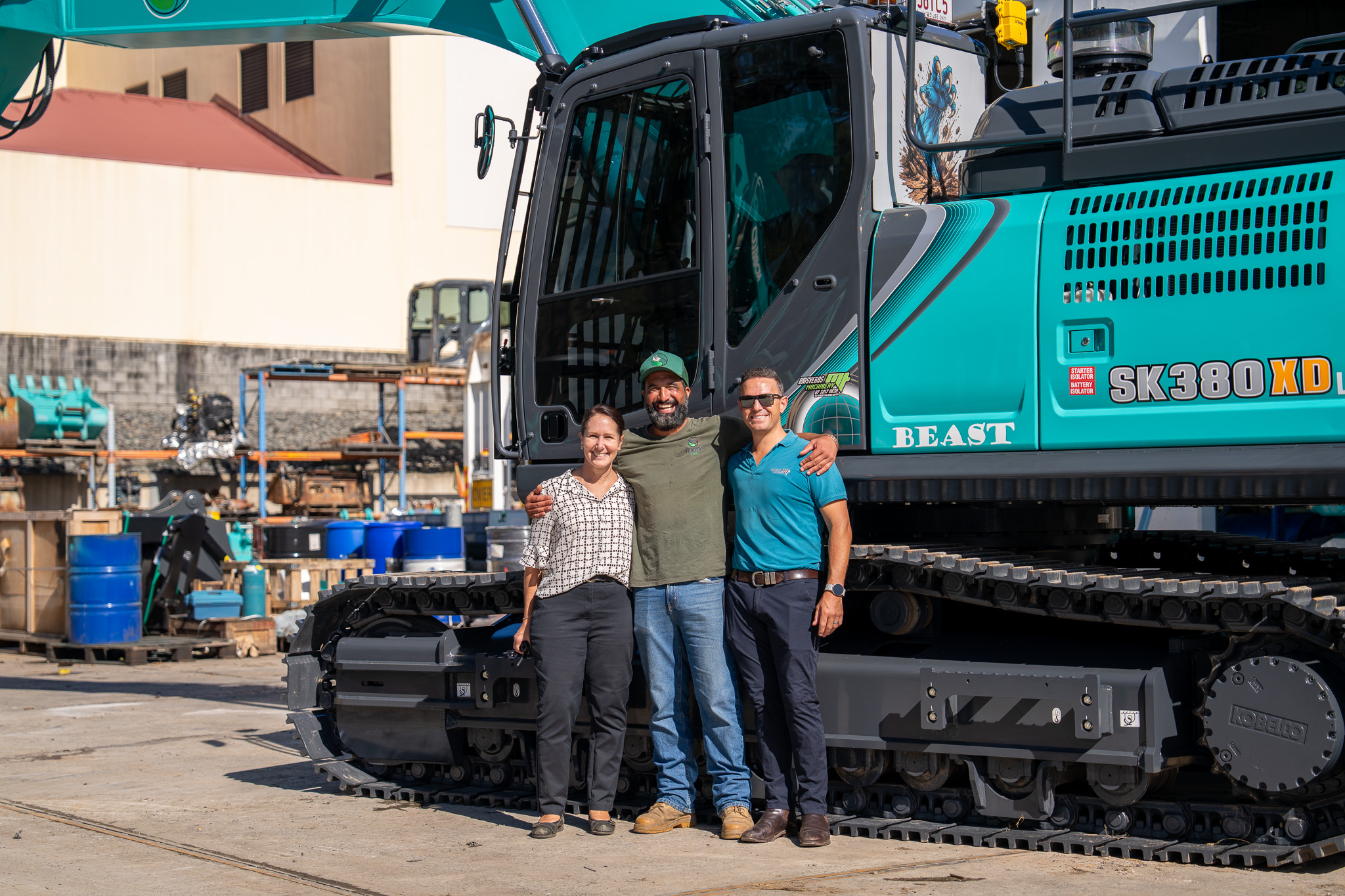 Tony Rore with Marco and a colleague beside a Tumeke Civil Kobelco